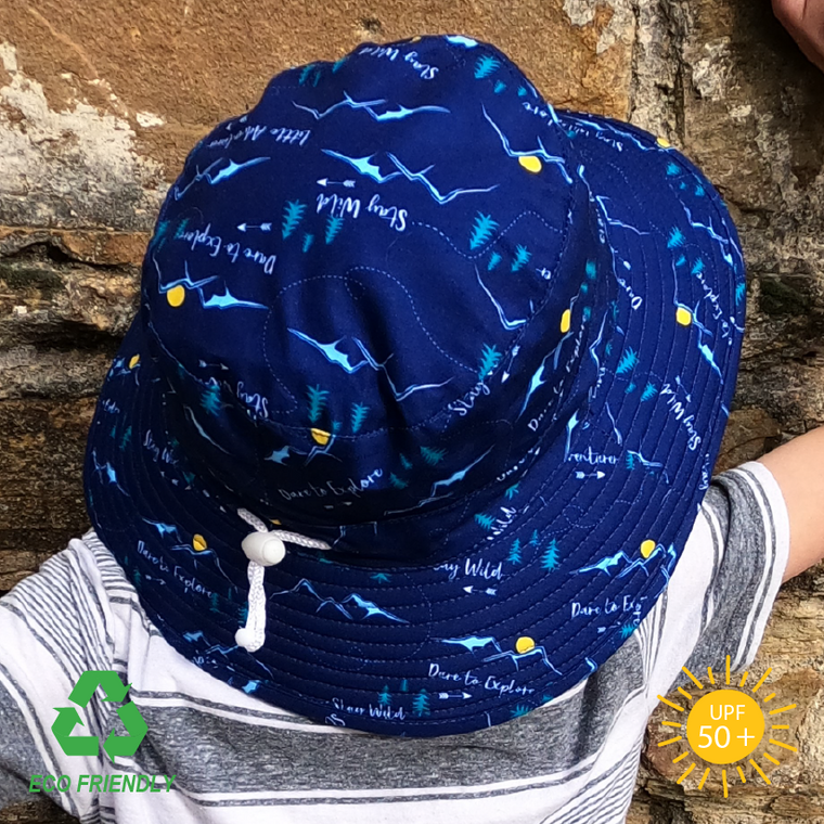 Side view of an adventure pattern recycled rPet fabric kids bucket sun hat for toddlers with a wide brim for excellent sun protection